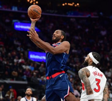 Los Angeles Clippers forward Kawhi Leonard shoots over Toronto Raptors forward Brandon Ingram during a 2026 game at Intuit Dome