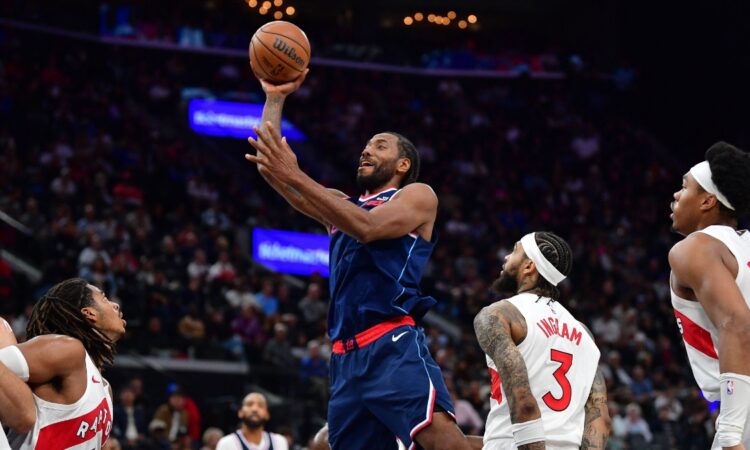 Los Angeles Clippers forward Kawhi Leonard shoots over Toronto Raptors forward Brandon Ingram during a 2026 game at Intuit Dome