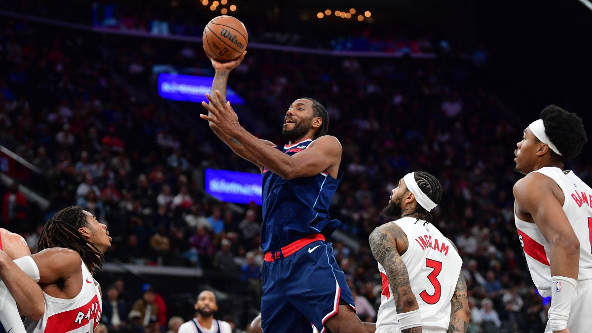 Los Angeles Clippers forward Kawhi Leonard shoots over Toronto Raptors forward Brandon Ingram during a 2026 game at Intuit Dome