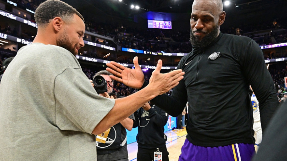LeBron James #23 of the Los Angeles Lakers and Stephen Curry #30 of the Golden State Warriors high five after a game at Chase Center.