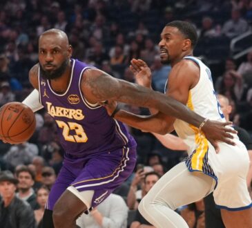 Los Angeles Lakers forward LeBron James drives with the ball against Golden State Warriors guard De'Anthony Melton in the first quarter at Chase Center.