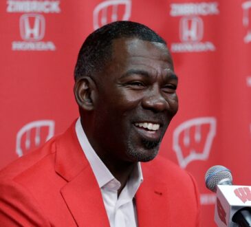 Former Dallas Mavericks executive Michael Finley speaks to the media at the Kohl Center in Madison, Wisconsin.