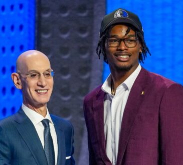 Morez Johnson Jr. wears a Dallas Mavericks cap and shakes hands with NBA Commissioner Adam Silver on stage after being selected No. 9 in the 2026 NBA Draft.