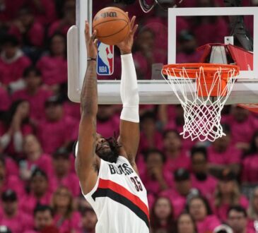 Robert Williams III of the Portland Trail Blazers converts an alley-oop dunk against the San Antonio Spurs in the 2026 NBA Playoffs