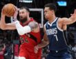 Toronto Raptors forward Sandro Mamukelashvili controls the ball as Dallas Mavericks forward Dwight Powell defends at Scotiabank Arena