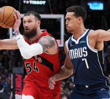 Toronto Raptors forward Sandro Mamukelashvili controls the ball as Dallas Mavericks forward Dwight Powell defends at Scotiabank Arena