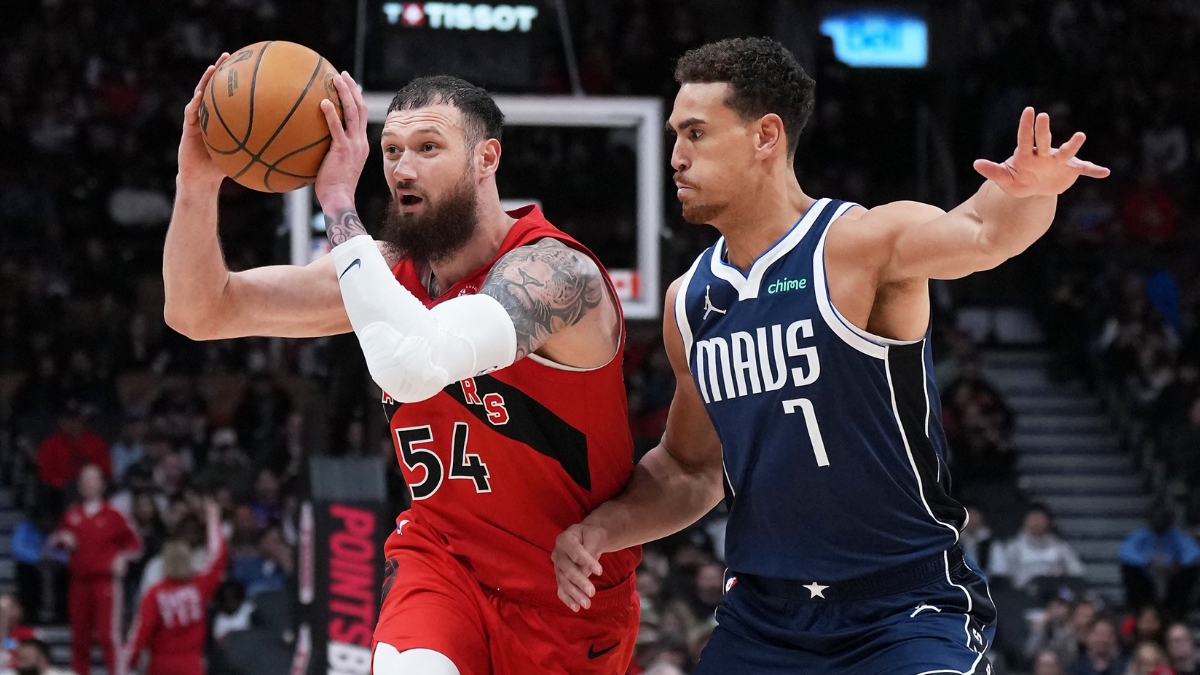 Toronto Raptors forward Sandro Mamukelashvili controls the ball as Dallas Mavericks forward Dwight Powell defends at Scotiabank Arena
