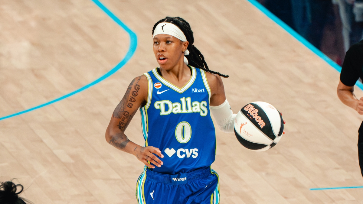 Dallas Wings guard Sug Sutton brings the ball up the court during her WNBA debut against the Las Vegas Aces at College Park Center in Arlington, Texas, on June 15, 2026.