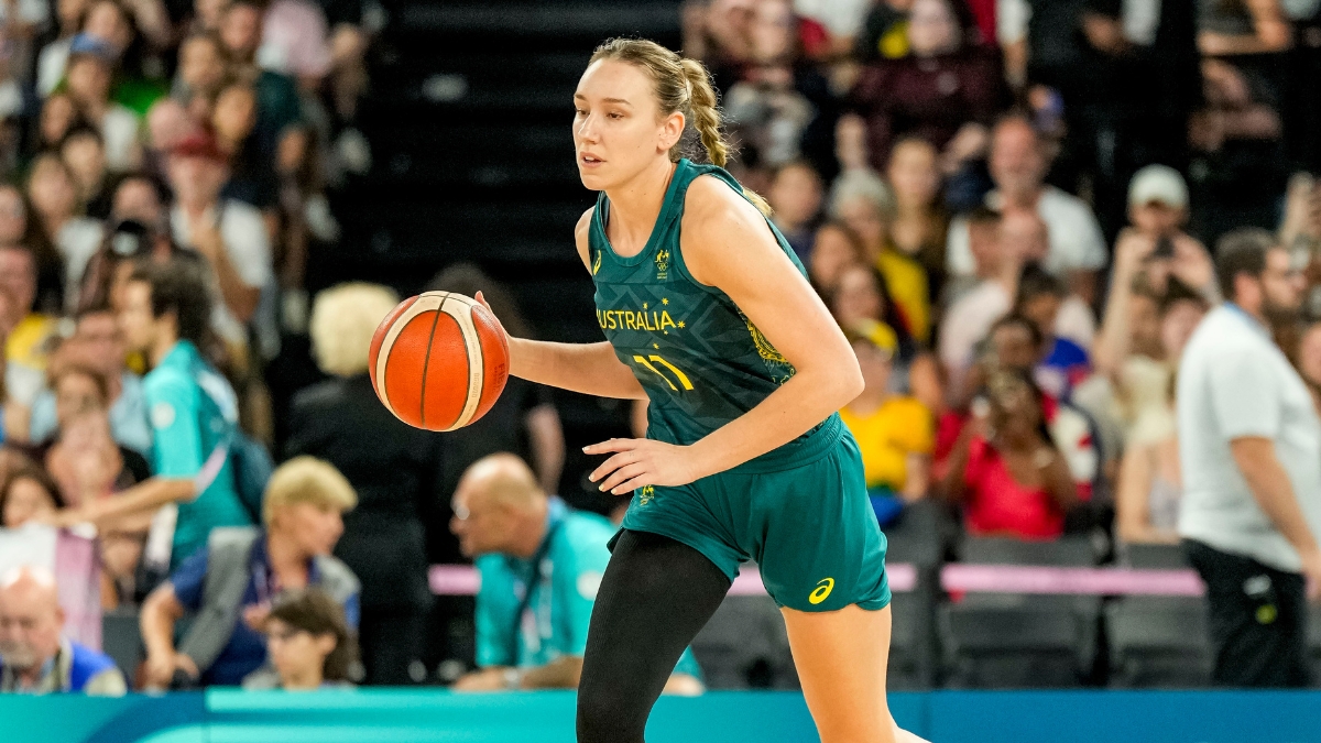 Australia forward Alanna Smith dribbles up the court in a green Opals uniform during the Paris 2024 Olympic semifinal against the United States.