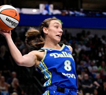Dallas Wings forward Alanna Smith leaps to keep the ball in bounds against the Chicago Sky at American Airlines Center.