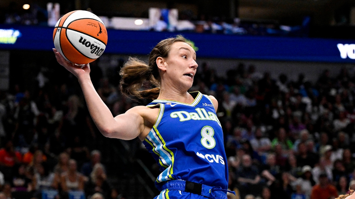Dallas Wings forward Alanna Smith leaps to keep the ball in bounds against the Chicago Sky at American Airlines Center.