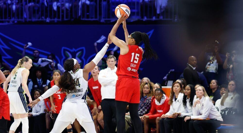 Atlanta Dream guard Allisha Gray shoots over the contest of Dallas Wings guard Arike Ogunbowale at College Park Center