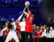 Atlanta Dream guard Allisha Gray shoots over the contest of Dallas Wings guard Arike Ogunbowale at College Park Center