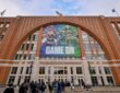 Exterior of American Airlines Center in Dallas, home of the Mavericks, with a Mavs and Stars banner above the west entrance