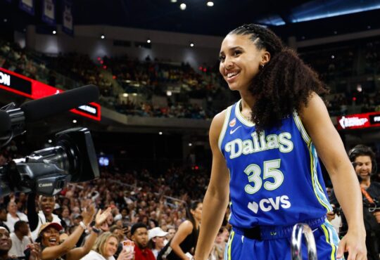 Dallas Wings guard Azzi Fudd smiles after winning the 2026 WNBA 3-Point Contest at Wintrust Arena in Chicago