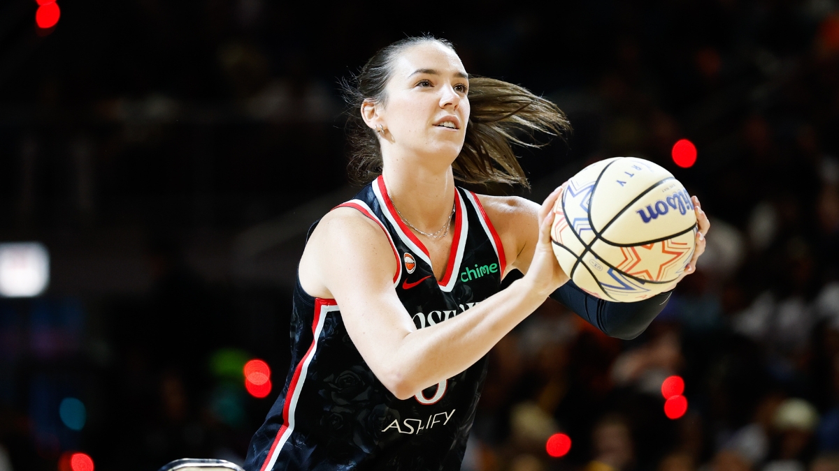 Portland Fire forward Bridget Carleton rises into her shooting motion, holding an All-Star Wilson ball with a rack visible at left, during the 2026 State Farm WNBA 3-Point Contest at Wintrust Arena in Chicago.