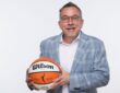 Dallas Wings general manager Curt Miller holds a Wilson WNBA game ball during 2026 Dallas Wings media day at College Park Center.