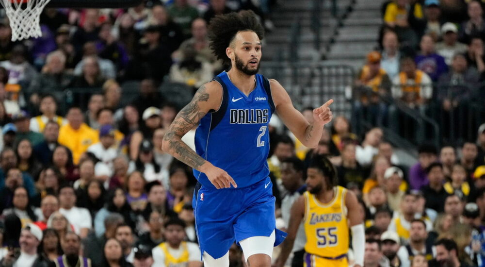 Dallas Mavericks center Dereck Lively II points downcourt after scoring against the Los Angeles Lakers.