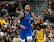 Dallas Mavericks center Dereck Lively II points downcourt after scoring against the Los Angeles Lakers.