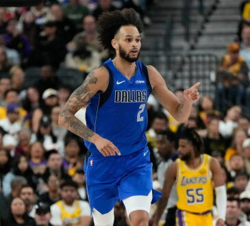 Dallas Mavericks center Dereck Lively II points downcourt after scoring against the Los Angeles Lakers.