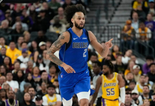 Dallas Mavericks center Dereck Lively II points downcourt after scoring against the Los Angeles Lakers.