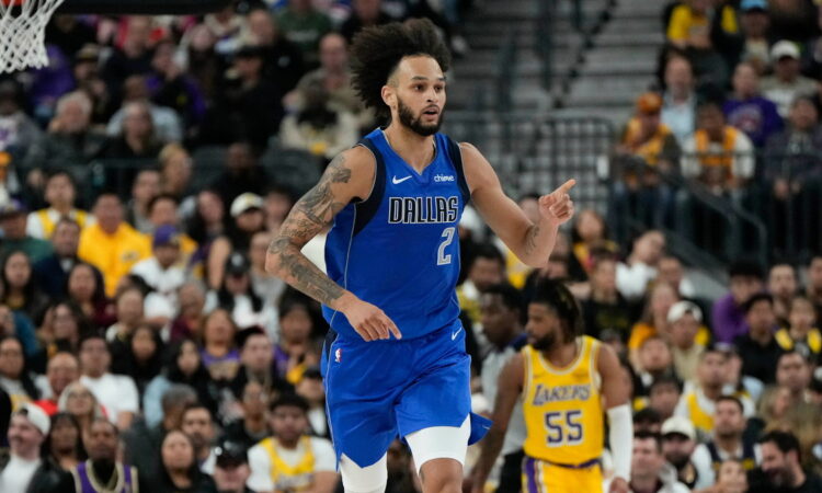 Dallas Mavericks center Dereck Lively II points downcourt after scoring against the Los Angeles Lakers.