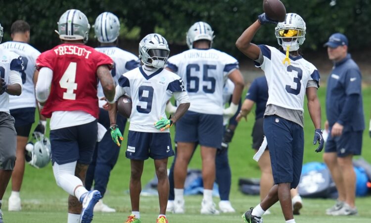 Dallas Cowboys wide receiver George Pickens #3 and quarterback Dak Prescott #4 run through a drill during practice at the Ford Center at The Star.