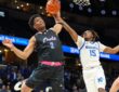 Florida Atlantic guard Isaiah Elohim reaches for a rebound against Memphis guard Julius Thedford at FedExForum