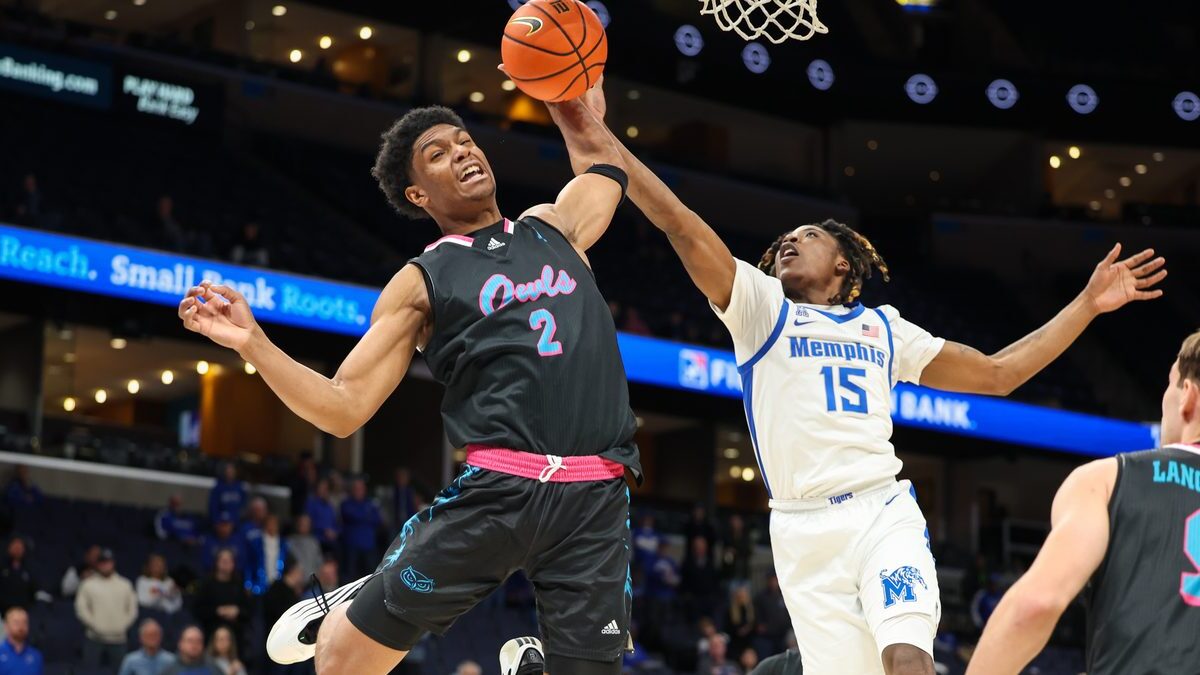 Florida Atlantic guard Isaiah Elohim reaches for a rebound against Memphis guard Julius Thedford at FedExForum