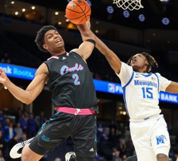 Florida Atlantic guard Isaiah Elohim reaches for a rebound against Memphis guard Julius Thedford at FedExForum