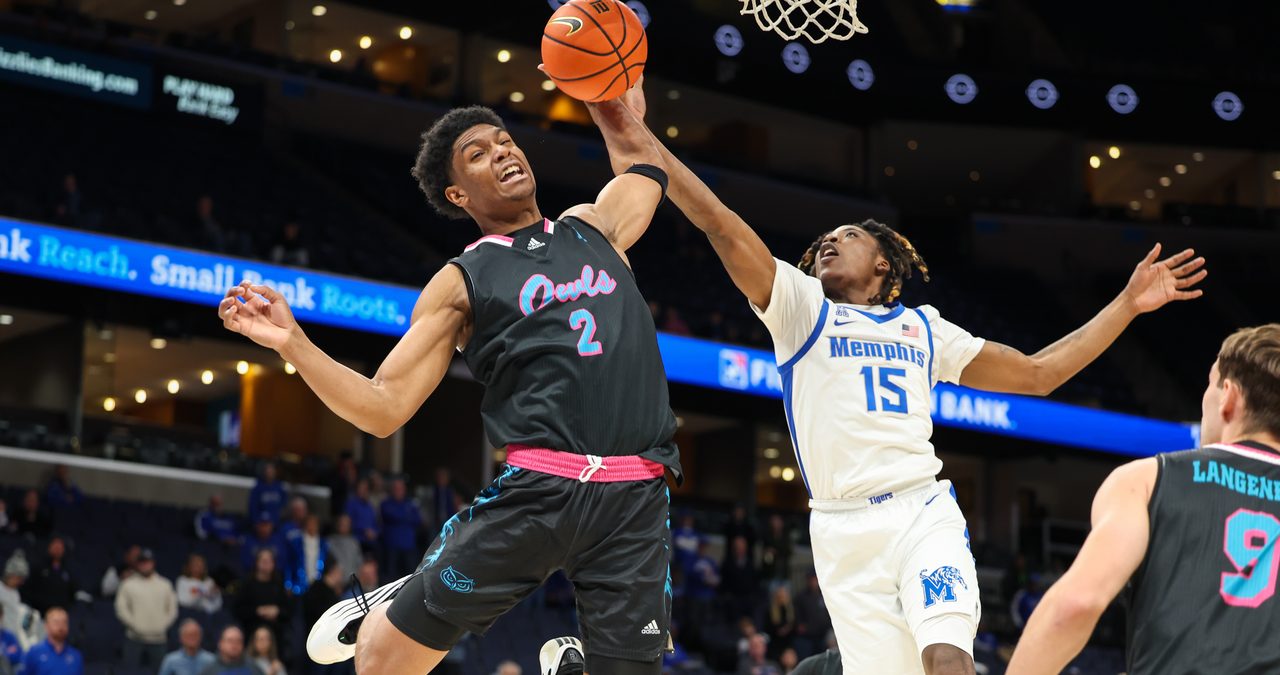 Florida Atlantic guard Isaiah Elohim reaches for a rebound against Memphis guard Julius Thedford at FedExForum