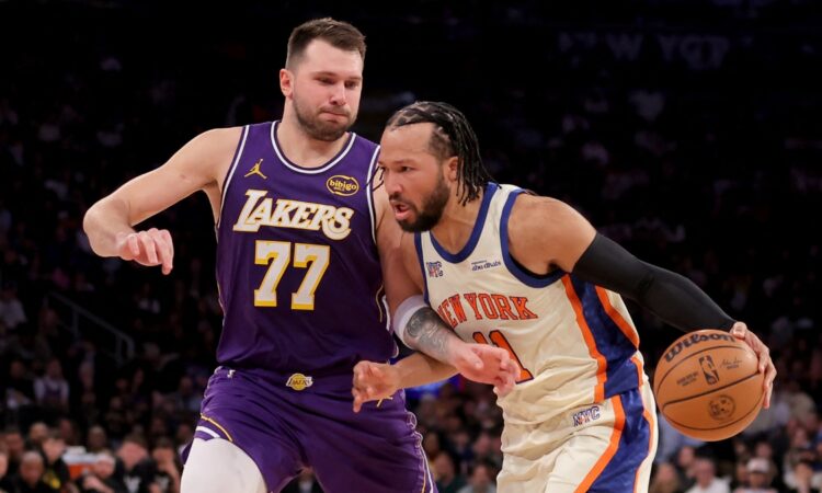 New York Knicks guard Jalen Brunson drives against Los Angeles Lakers guard Luka Dončić at Madison Square Garden