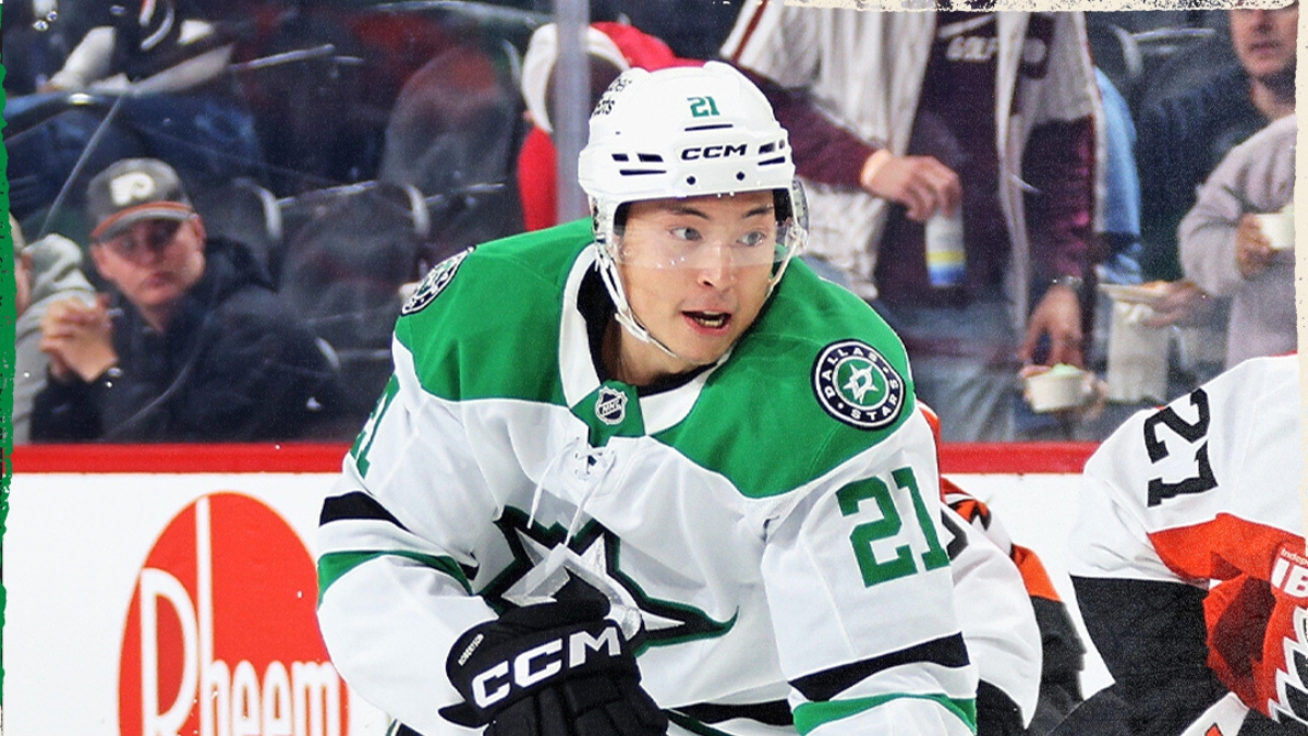 Dallas Stars left wing Jason Robertson (21) skates during a game, with an opposing player in an orange uniform nearby.