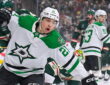 Dallas Stars forward Jason Robertson raises a fist to celebrate a power-play goal against the Minnesota Wild.