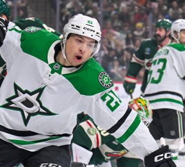 Dallas Stars forward Jason Robertson raises a fist to celebrate a power-play goal against the Minnesota Wild.