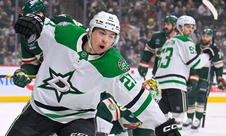 Dallas Stars forward Jason Robertson raises a fist to celebrate a power-play goal against the Minnesota Wild.