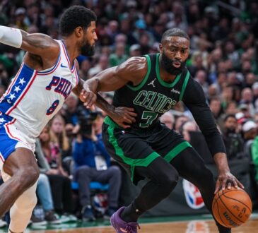 Jaylen Brown drives to the basket while defended by Paul George during a 2026 NBA playoff game between the Celtics and 76ers.
