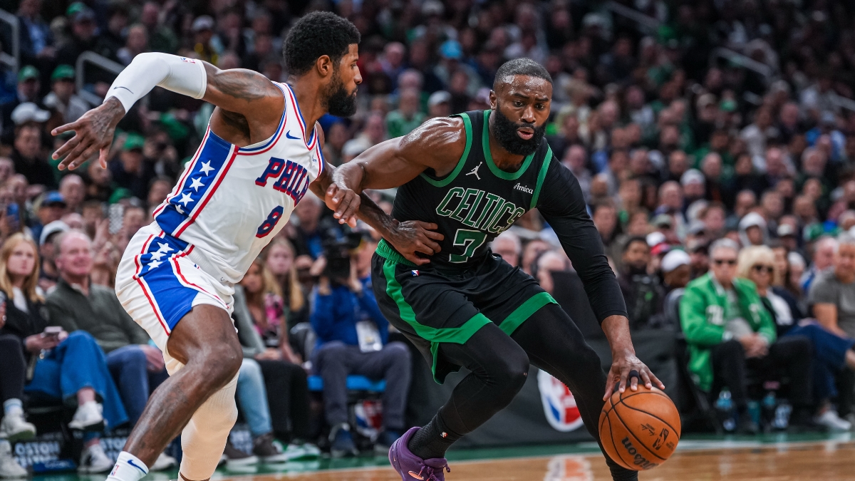 Jaylen Brown drives to the basket while defended by Paul George during a 2026 NBA playoff game between the Celtics and 76ers.