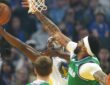 Golden State Warriors forward Jimmy Butler III shoots against Dallas Mavericks forward Anthony Davis during the first quarter on Christmas Day at Chase Center.
