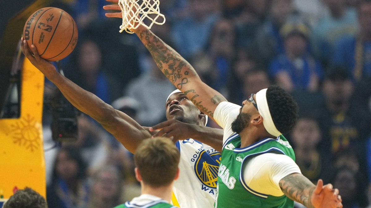Golden State Warriors forward Jimmy Butler III shoots against Dallas Mavericks forward Anthony Davis during the first quarter on Christmas Day at Chase Center.
