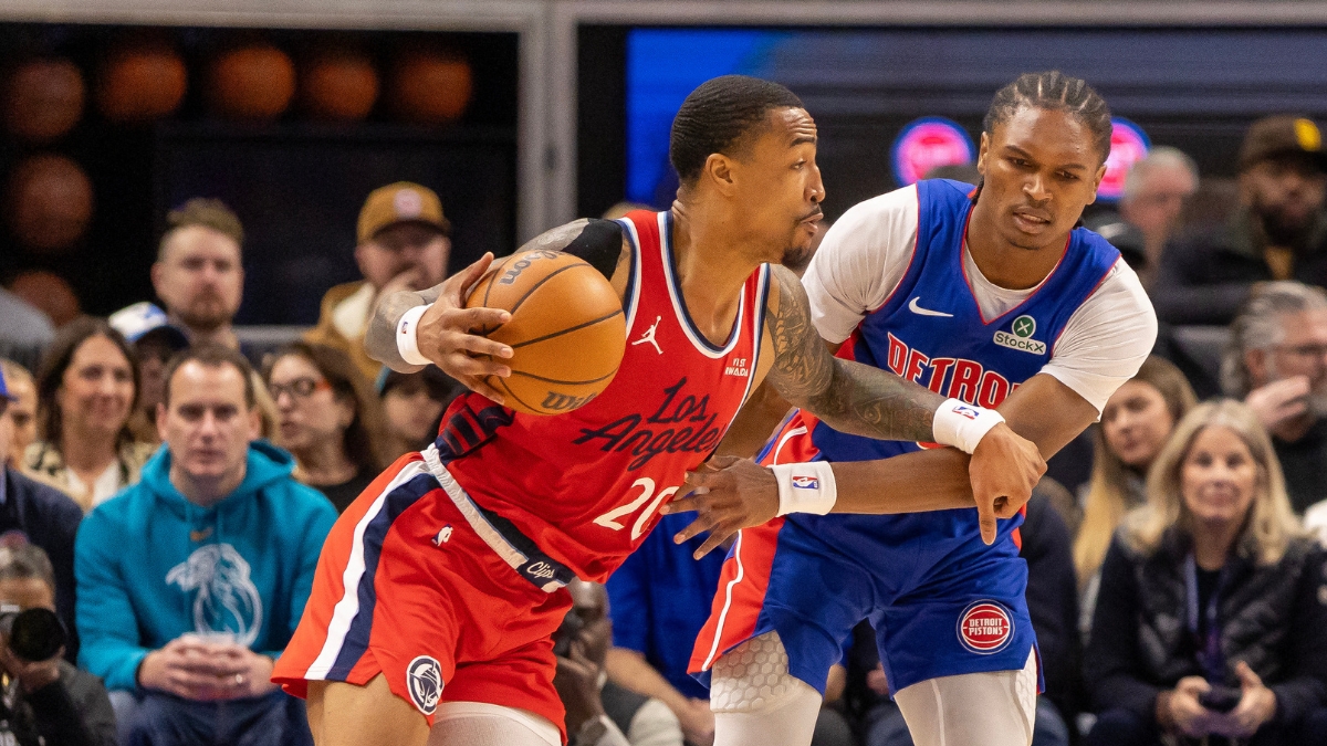 LA Clippers forward John Collins drives against Detroit Pistons guard Ausar Thompson at Little Caesars Arena