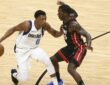 Dallas Mavericks guard Josh Richardson protects the ball from Miami Heat guard Kendrick Nunn on the drive.