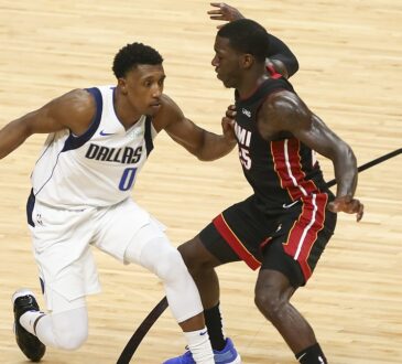 Dallas Mavericks guard Josh Richardson protects the ball from Miami Heat guard Kendrick Nunn on the drive.