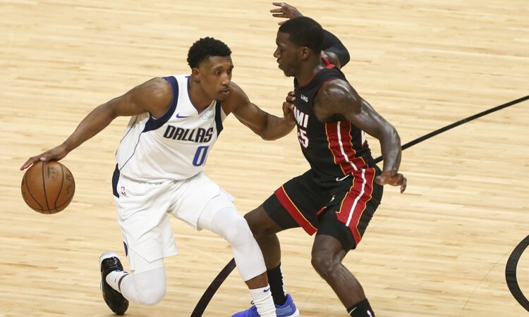 Dallas Mavericks guard Josh Richardson protects the ball from Miami Heat guard Kendrick Nunn on the drive.