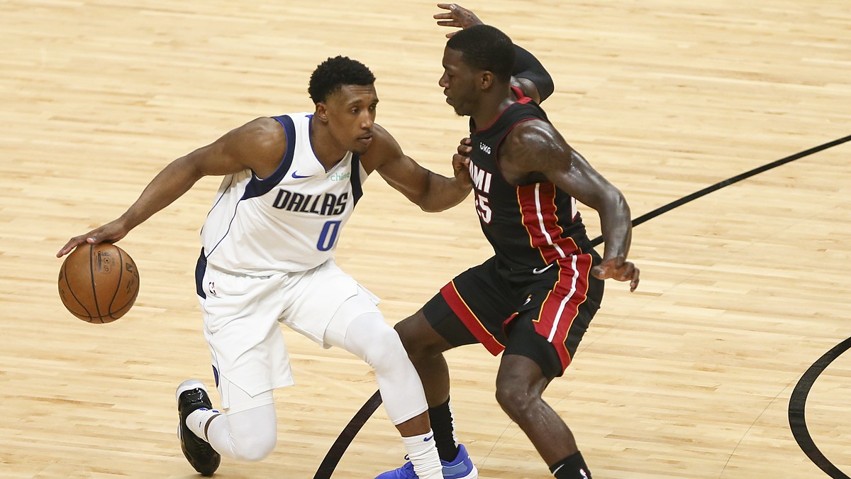 Dallas Mavericks guard Josh Richardson protects the ball from Miami Heat guard Kendrick Nunn on the drive.