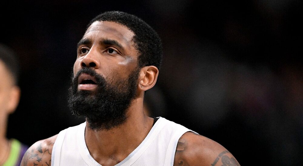 Dallas Mavericks guard Kyrie Irving looks up while standing on the court during a game against the New Orleans Pelicans.