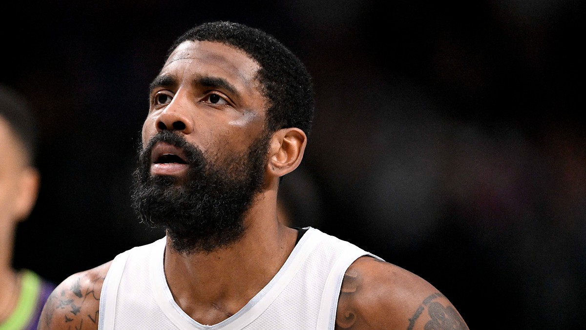 Dallas Mavericks guard Kyrie Irving looks up while standing on the court during a game against the New Orleans Pelicans.
