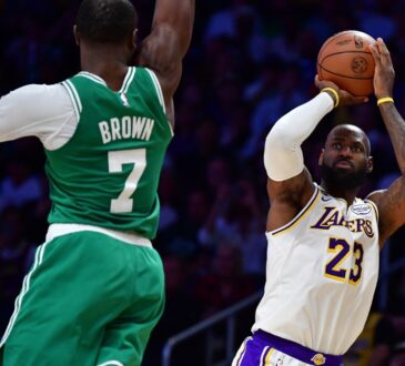 Los Angeles Lakers forward LeBron James #23 shoots a jumper against Boston Celtics guard Jaylen Brown #7 at Crypto.com Arena.