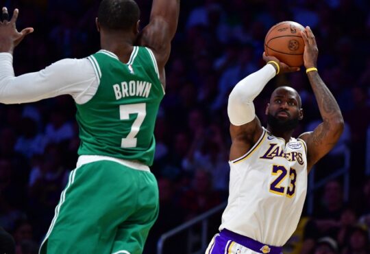 Los Angeles Lakers forward LeBron James #23 shoots a jumper against Boston Celtics guard Jaylen Brown #7 at Crypto.com Arena.