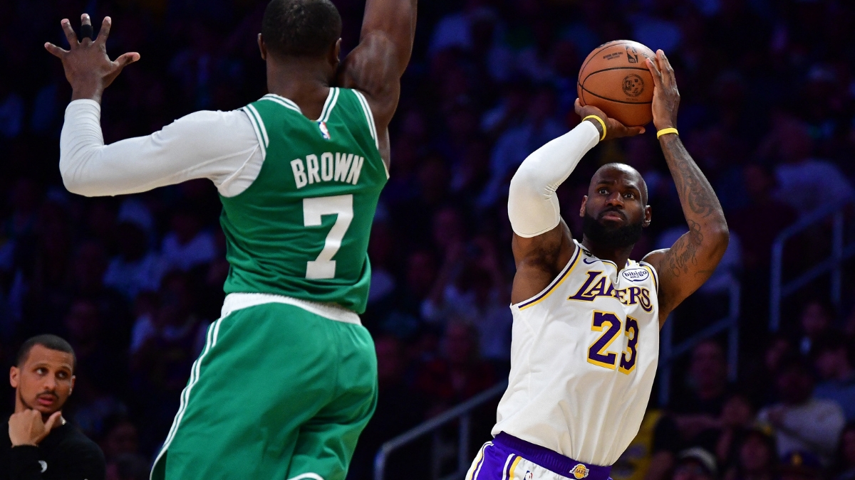 Los Angeles Lakers forward LeBron James #23 shoots a jumper against Boston Celtics guard Jaylen Brown #7 at Crypto.com Arena.